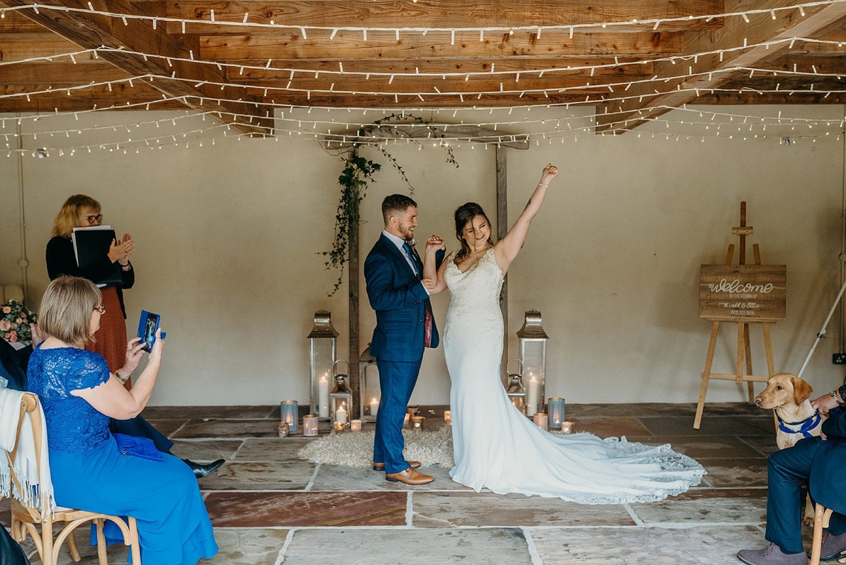 elopement wedding ceremony wood arch stone floor fairy lights