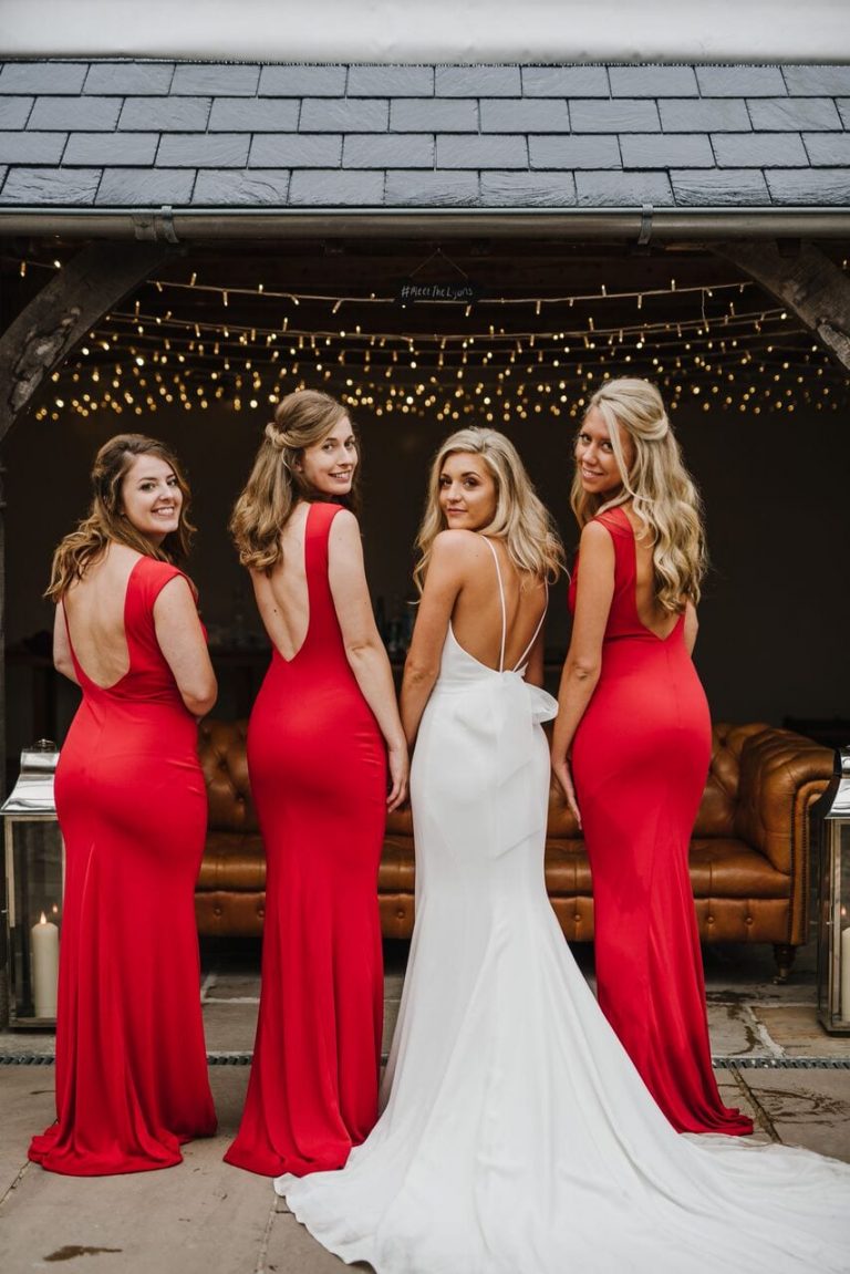 bridesmaids ever after blog post bride and bridesmaids in bright red