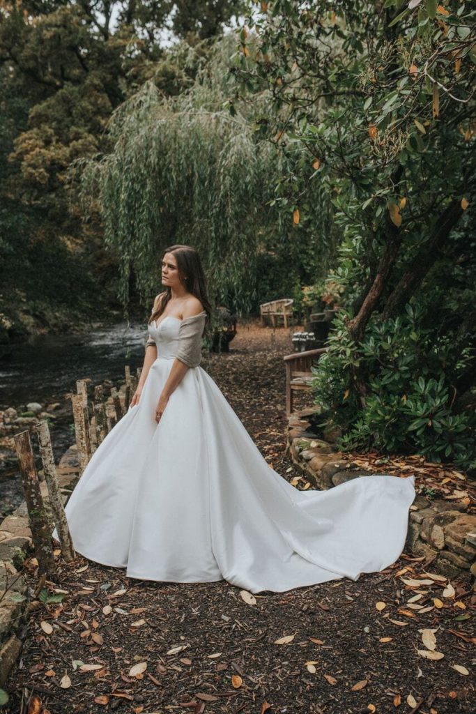 bride on riverwalk with large a-line wedding dress
