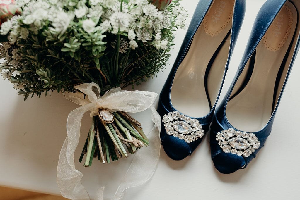 bride's blue shoes with gem detail on toes
