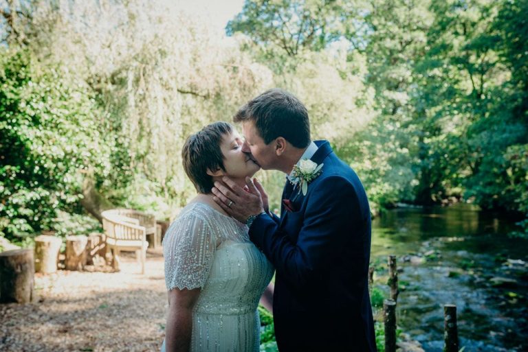 bride and groom kiss