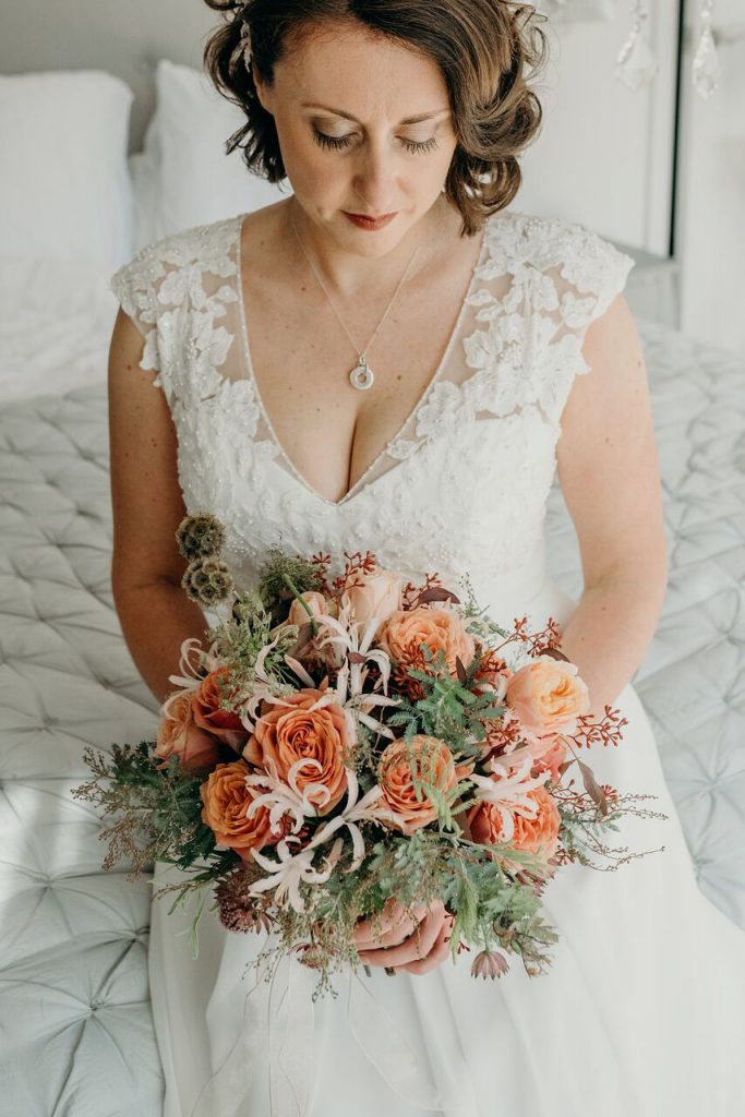 autumn styling bridal bouquet with bride