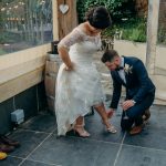 bride & groom changing shoes