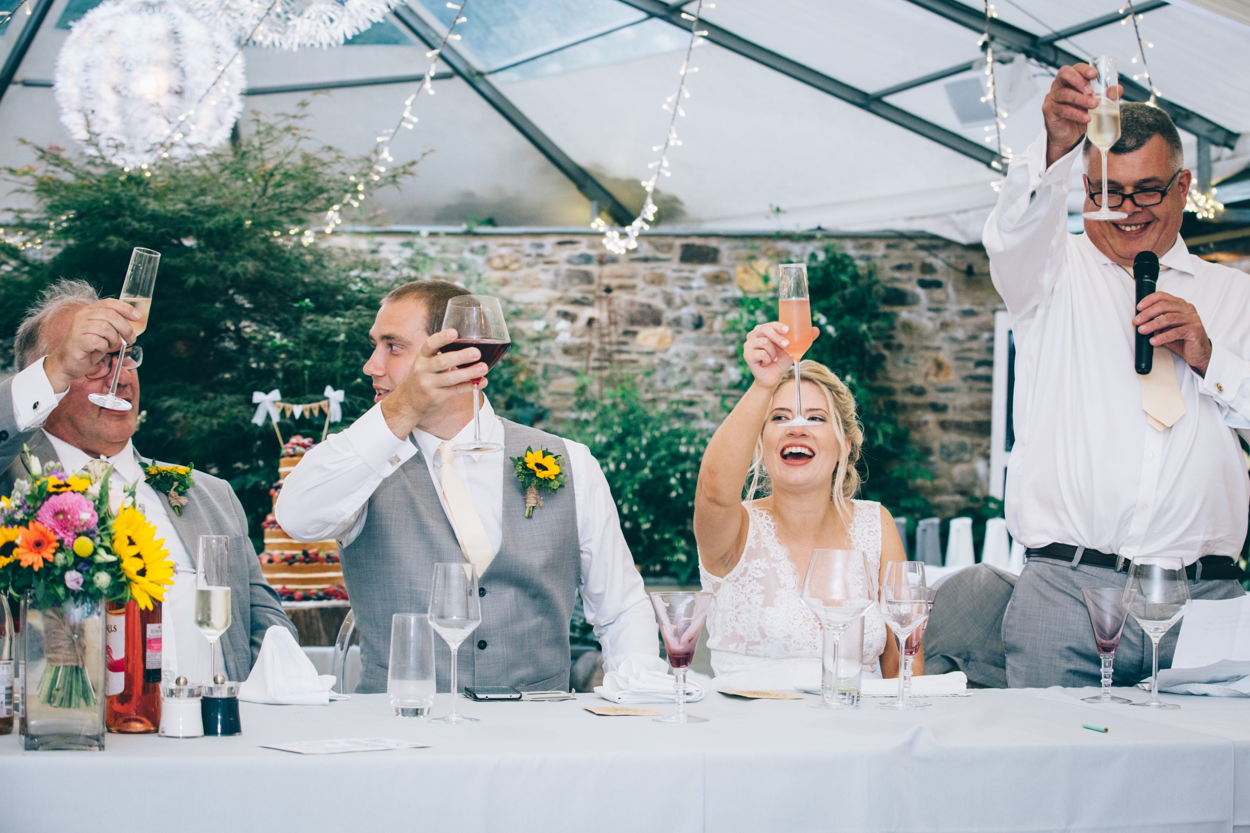 bride groom wedding speeches raising glasses