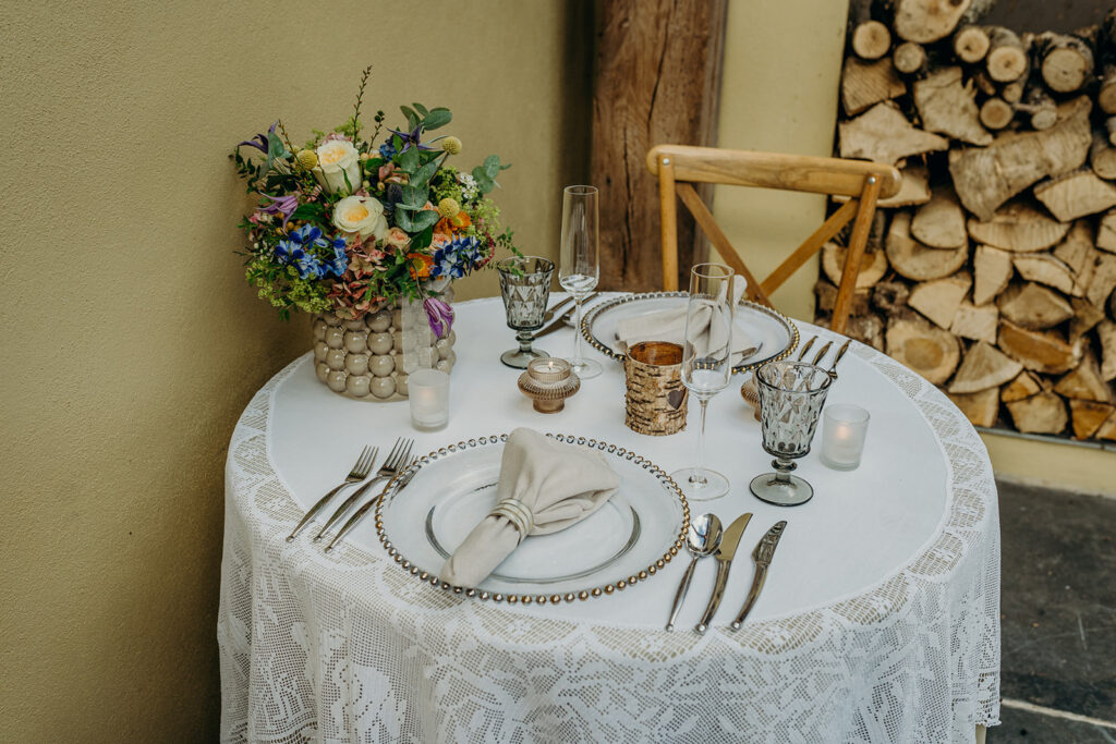 sweetheart table with flowers and table linen rustic setting