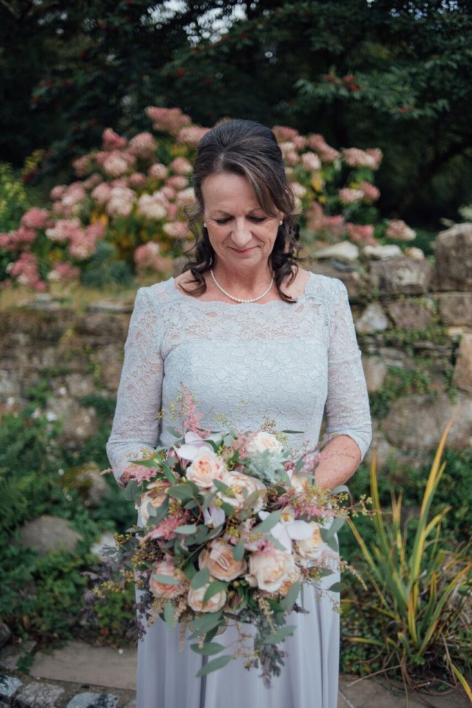 throwback to bride in grey dress with bridal bouquet 