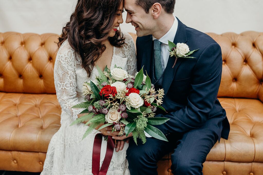 bride and groom on sofa supreme styling blog
