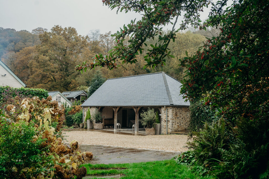 winter wedding ceremony location at Ever After stone barn with slate roof set in Dartmoor valley