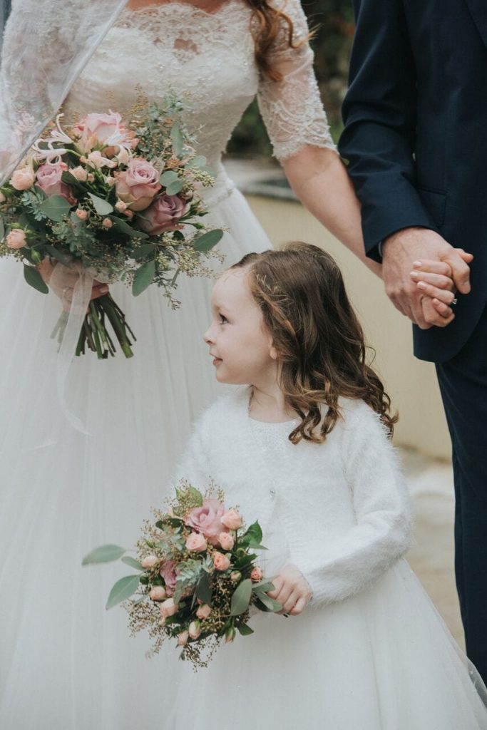 bride and daughter with matching bouquets at a winter elopement wedding 