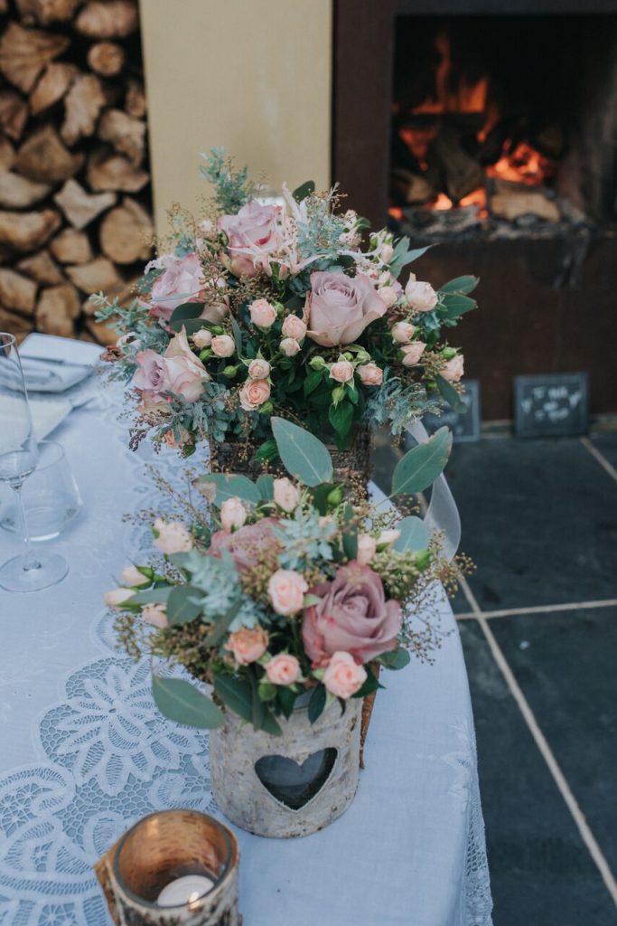 two bridal bouquets by open fire