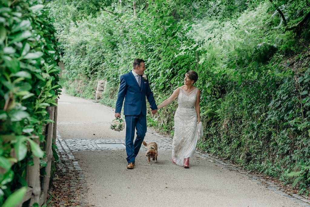 bride & groom with dog country lane 