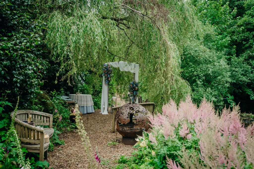 outdoor wedding ceremony in Dartmoor set up under a willow tree 