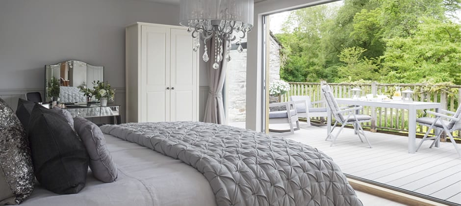 honeymoon cottage bedroom suite bifold doors onto private woodland decking