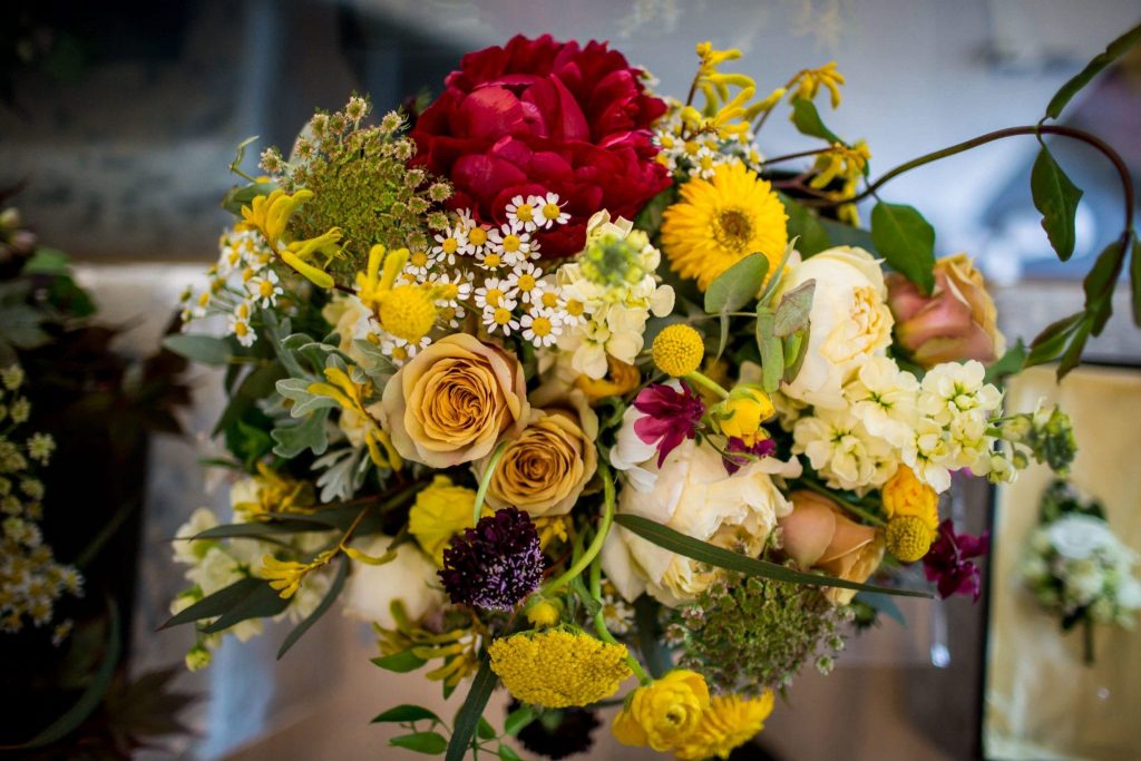 real wedding mustard roses and claret peonies bridal bouquet
