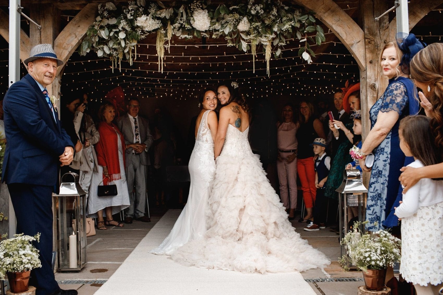 Two brides walking down the isle
